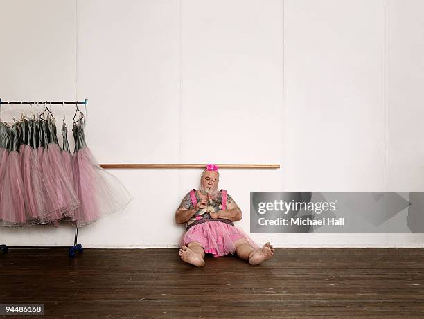 tattooed man in tutu - men doing quirky things stock-fotos und bilder