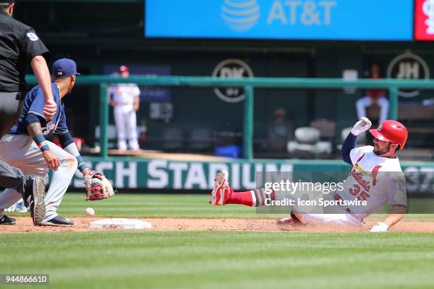 St. Louis Cardinals third baseman Matt Carpenter slides safely into second base during the 2018 game between the St. Louis Cardinals and the...