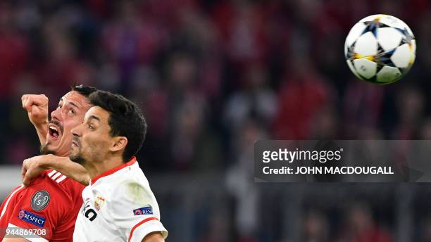 Bayern Munich's forward Sandro Wagner and Sevilla's Spanish midfielder Jesus Navas vie for the ball during the UEFA Champions League quarter-final...