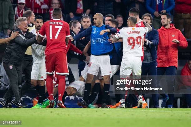 Players and officials of both teams fight during the UEFA Champions League Quarter Final second leg match between Bayern Muenchen and Sevilla FC at...