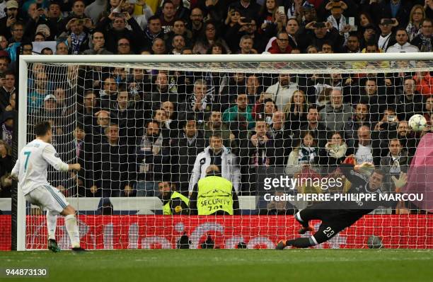 Real Madrid's Portuguese forward Cristiano Ronaldo shoots a penalty kick to score a goal during the UEFA Champions League quarter-final second leg...