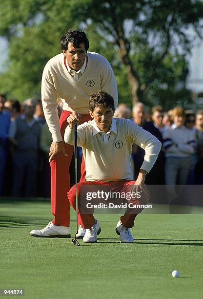 European team pairing Seve Ballesteros and Manuel Pinero line up a putt during the Ryder Cup at the Belfry in Sutton Coldfield, England. \ Mandatory...