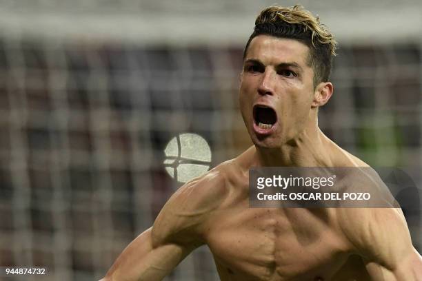 Real Madrid's Portuguese forward Cristiano Ronaldo celebrates after scoring a penalty during the UEFA Champions League quarter-final second leg...