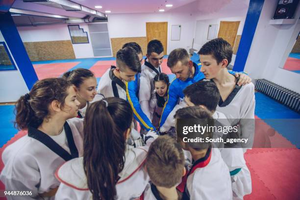 taekwondo fighters holding hands - karate belt stock pictures, royalty-free photos & images