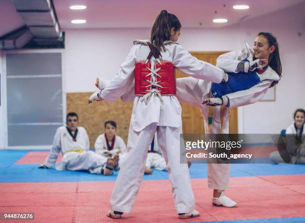 cute girls taekwondo fight - karate belt stock pictures, royalty-free photos & images