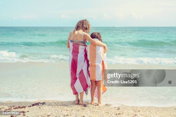 day at the beach - beach towel stock pictures, royalty-free photos & images