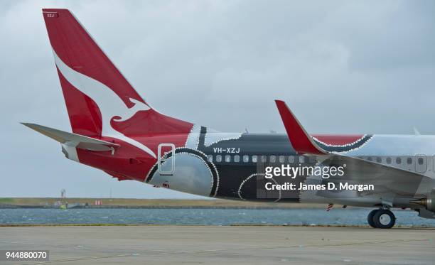 The latest Qantas plane to be painted in aboriginal colours lands at Sydney Airport on November 11, 2013 in Sydney, Australia. The latest aircraft in...