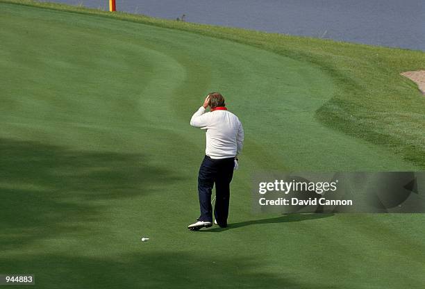 Craig Stadler of the USA scratches his head after missing a tiny putt on the 18th green during the Saturday morning fourballs of the Ryder Cup at the...