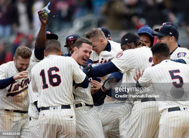 The Minnesota Twins congratulate Max Kepler on a solo walk-off home run against the Houston Astros during the ninth inning of the game on April 11,...