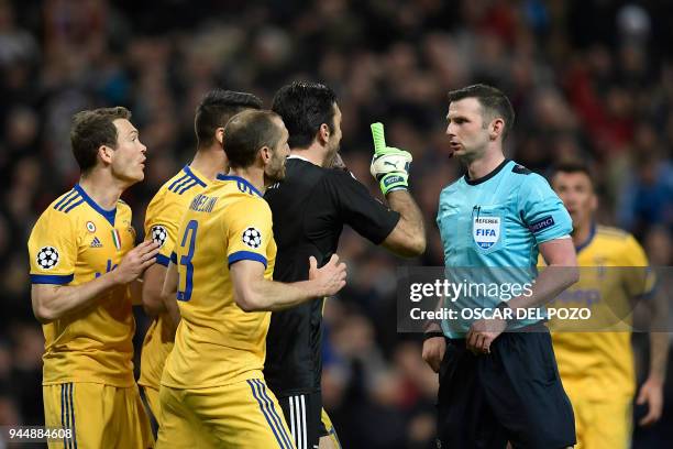 Juventus' Italian goalkeeper Gianluigi Buffon argues with the referee during the UEFA Champions League quarter-final second leg football match...