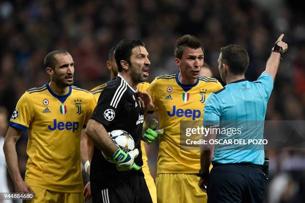 Juventus' Italian goalkeeper Gianluigi Buffon argues with the referee during the UEFA Champions League quarter-final second leg football match...