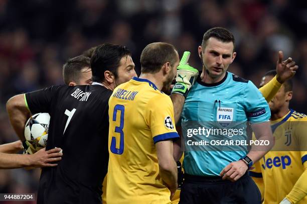 Juventus' Italian goalkeeper Gianluigi Buffon argues with the referee during the UEFA Champions League quarter-final second leg football match...