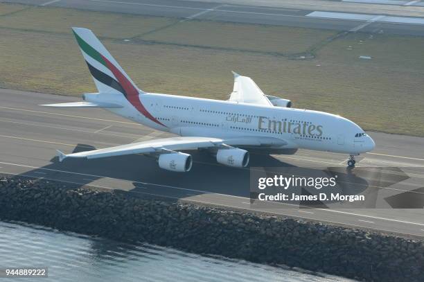 An Emirates airlines Airbus A380 taxiing and taking off at Sydney International Airport on August 30, 2013 in Sydney, Australia.