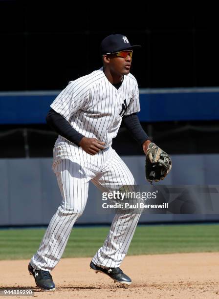 Miguel Andujar of the New York Yankees gets on his toes as the ball is batted in the 7th inning in an MLB baseball game against the Baltimore Orioles...