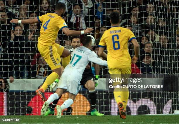 Real Madrid's Spanish midfielder Lucas Vazquez vies with Juventus' Italian defender Medhi Benatia in front of Juventus' Italian goalkeeper Gianluigi...