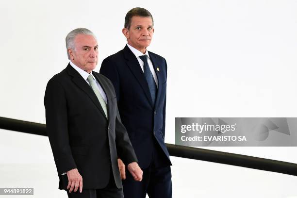 Brazilian President Michel Temer and acting Defense Minister Joaquim Silva e Luna, arrive to the presentation ceremony for promoted General Officers...