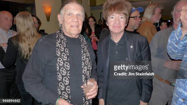 Photographer Henry Diltz and Rodney Bingenheimer pose for a portrait at the Leica Gallery in Los Angeles, California on April 17, 2013.