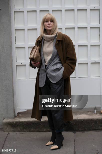 Fashion blogger Jeanette Friis Madsen wears a Designers Remix blazer, Hugo Boss coat, Just Female trousers, Céline boots, Filippa K knitted jumper...