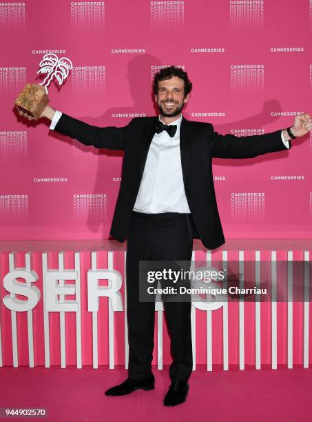 Francesco Montanari poses with the Best Performance award for the serie 'Il Cacciatore' at the Canneseries Winners Photocall during the 1st Cannes...