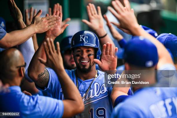 Cheslor Cuthbert of the Kansas City Royals celebrates in the dugout after scoring a run in the fourth inning against the Seattle Mariners at Kauffman...