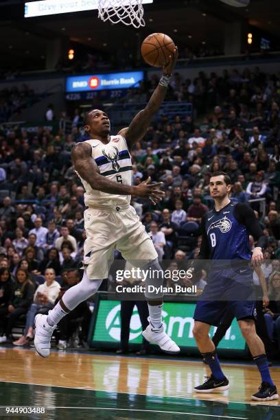 Eric Bledsoe of the Milwaukee Bucks attempts a shot past Mario Hezonja of the Orlando Magic in the first quarter at the Bradley Center on April 9,...