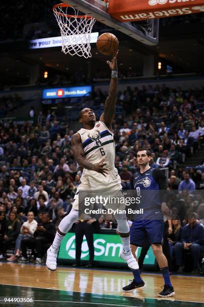 Eric Bledsoe of the Milwaukee Bucks attempts a shot past Mario Hezonja of the Orlando Magic in the first quarter at the Bradley Center on April 9,...
