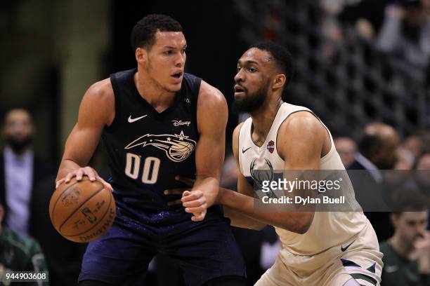 Aaron Gordon of the Orlando Magic dribbles the ball while being guarded by Jabari Parker of the Milwaukee Bucks in the first quarter at the Bradley...
