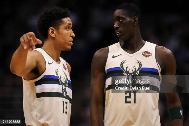 Malcolm Brogdon and Tony Snell of the Milwaukee Bucks meet in the second quarter against the Orlando Magic at the Bradley Center on April 9, 2018 in...