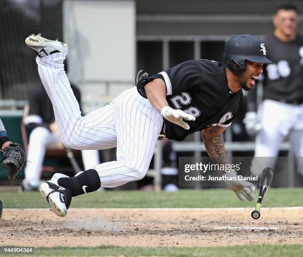 Leury Garcia of the Chicago White Sox hits the ground after being hit on the shin by a pitch in the 7th inning against the Tampa Bay Rays at...