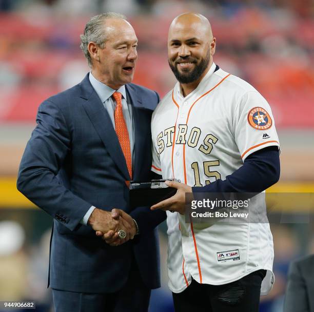 Houston Astros owner Jim Crane presents a World Series ring to Carlos Beltran at Minute Maid Park on April 3, 2018 in Houston, Texas.