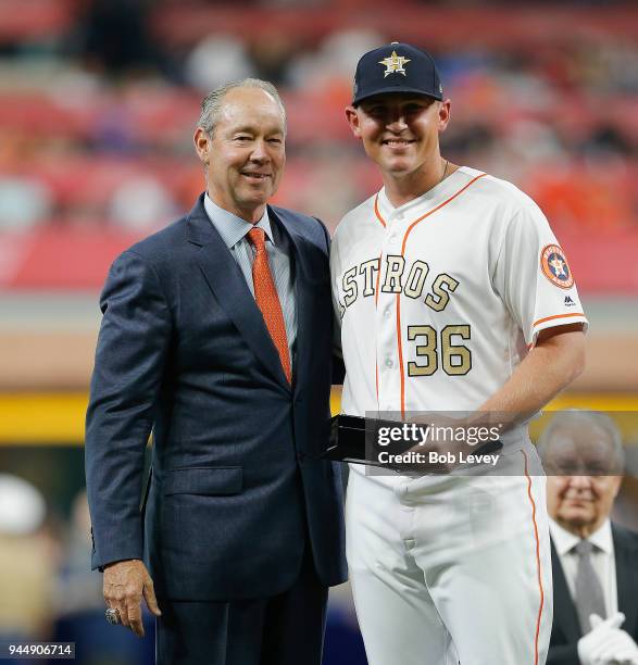 Houston Astros owner Jim Crane presents a World Series ring to Will Harris of the Houston Astros at Minute Maid Park on April 3, 2018 in Houston,...