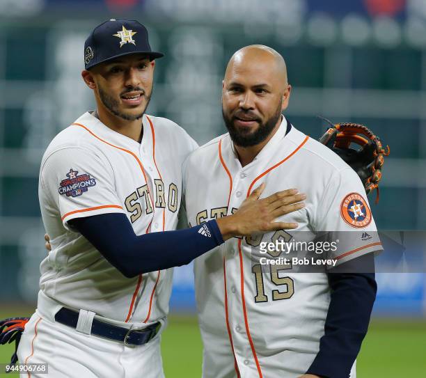 Carlos Correa of the Houston Astros and Carlos Beltran at Minute Maid Park on April 3, 2018 in Houston, Texas.
