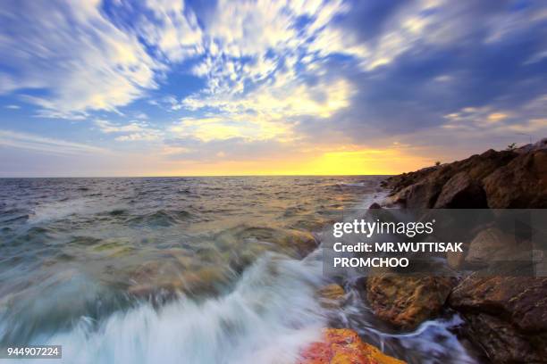 sea wave hit the rock at sunset. - chanthaburi province stock pictures, royalty-free photos & images
