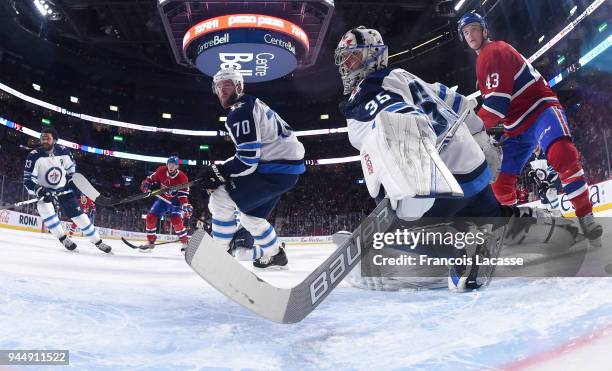 Steve Mason of the Winnipeg Jets defends the goal against the Montreal Canadiens in the NHL game at the Bell Centre on April 3, 2018 in Montreal,...