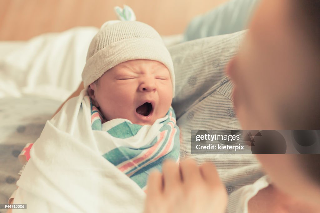 Sleepy baby yawning