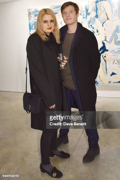 Camille Benett and Dominic Jones attend a private view of "There" by Tomo Campbell at The Cob Gallery on April 11, 2018 in London, England.