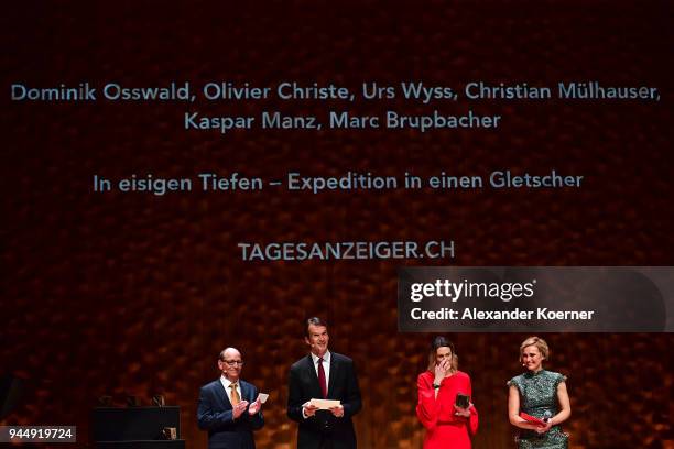 Jury members Ruediger Dietz, Klaus Brinkbaeumer, Anja Reschke and host Caren Miosga speak on stage at the Nannen Award 2018 at Elbphilharmonie on...