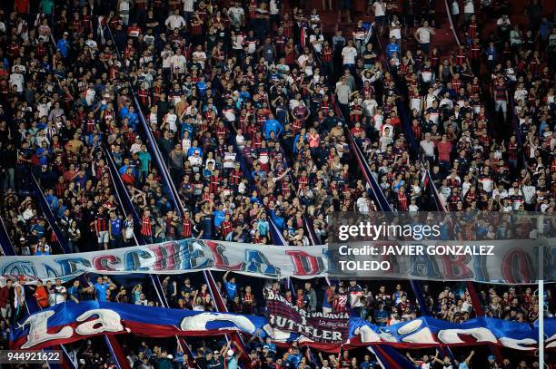Supporters of Argentina's San Lorenzo cheer for their team during their Copa Sudamericana first stage first leg football match, against Atletico...