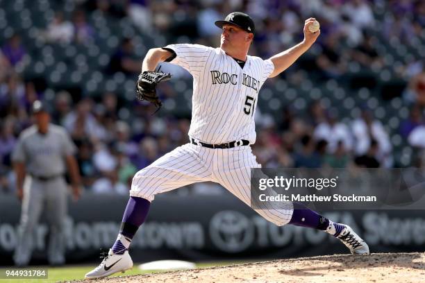 Jake McGee of the Colorado Rockies throws in the eighth inning against the San Diego Padres at Coors Field on April 11, 2018 in Denver, Colorado.