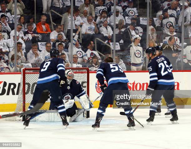 Andrew Copp, Mark Scheifele, Paul Stastny and Kyle Connor of the Winnipeg Jets takes shots on goaltender Steve Mason during the pre-game warm up...