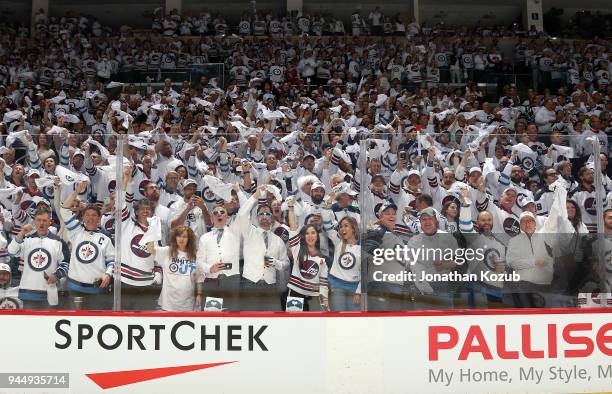 Fan wave white towels as they create the Whiteout in the stands prior to puck drop between the Winnipeg Jets and the Minnesota Wild in Game One of...
