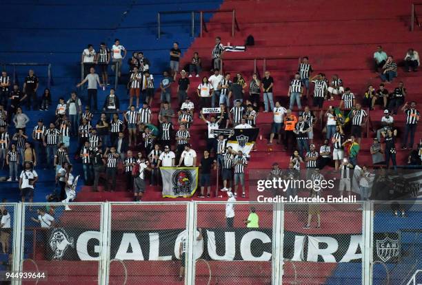 Fans of Atletico Mineiro cheer for their team during a match between San Lorenzo and Atletico Mineiro as part of Copa CONMEBOL Sudamericana 2018 at...