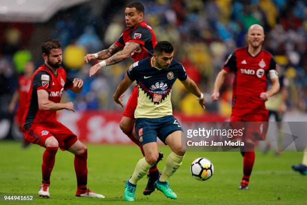 Liam Fraser and Gregory van der Wiel of Toronto chase Henry Martin of America during the semifinal second leg match between America and Toronto at...