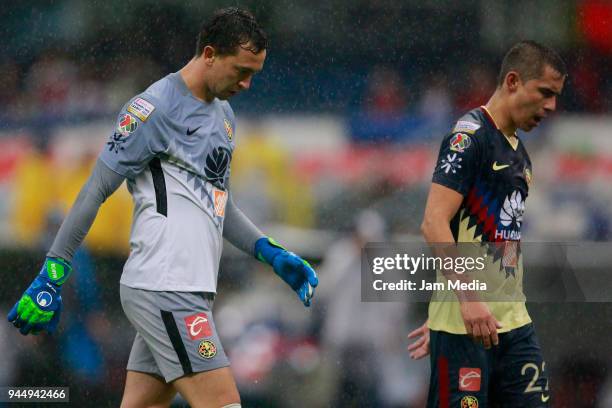 Agustin Marchesin and Paul Aguilar of America react after the semifinal second leg match between America and Toronto at Azteca Stadium on April 10,...