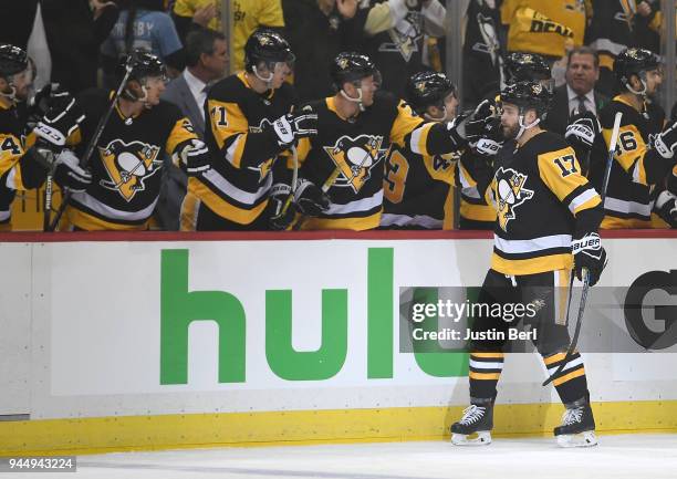 Bryan Rust of the Pittsburgh Penguins celebrates with teammates on the bench after scoring a goal in the first period in Game One of the Eastern...