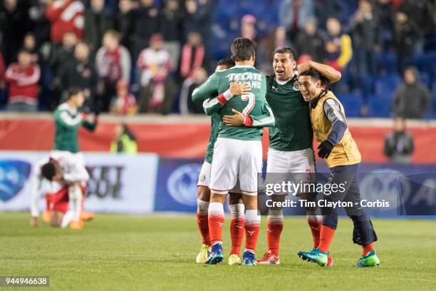 Carlos Salcido of C.D. Guadalajara and Oswaldo Alanis of C.D. Guadalajara celebrate with team mates after the final whistle during the New York Red...