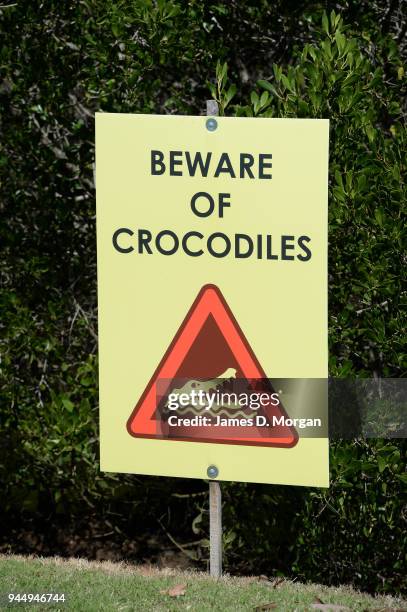 Port Douglas golf course with crocodile warning on August 09, 2013 in Port Douglas, Queensland, Australia. With thousands of visitors to Queensland...