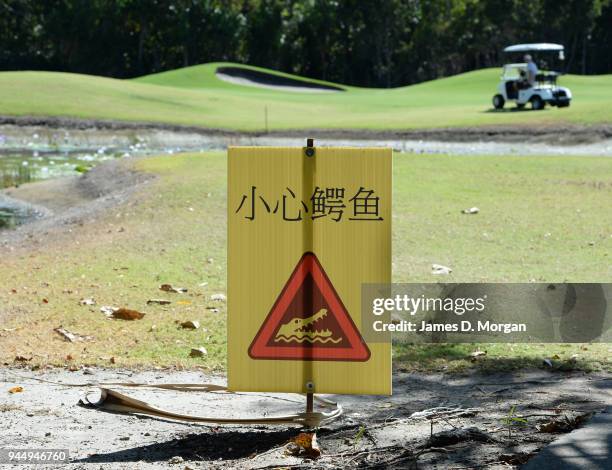 Port Douglas golf course with crocodile warning on August 09, 2013 in Port Douglas, Queensland, Australia. With thousands of visitors to Queensland...