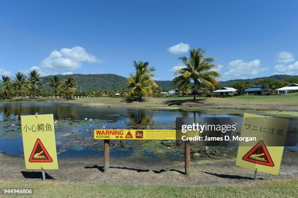 Port Douglas golf course with crocodile warning on August 09, 2013 in Port Douglas, Queensland, Australia. With thousands of visitors to Queensland...