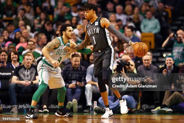 Angelo Russell of the Brooklyn Nets looks dribbles the ball while guarded by Shane Larkin of the Boston Celtics during a game at TD Garden on April...